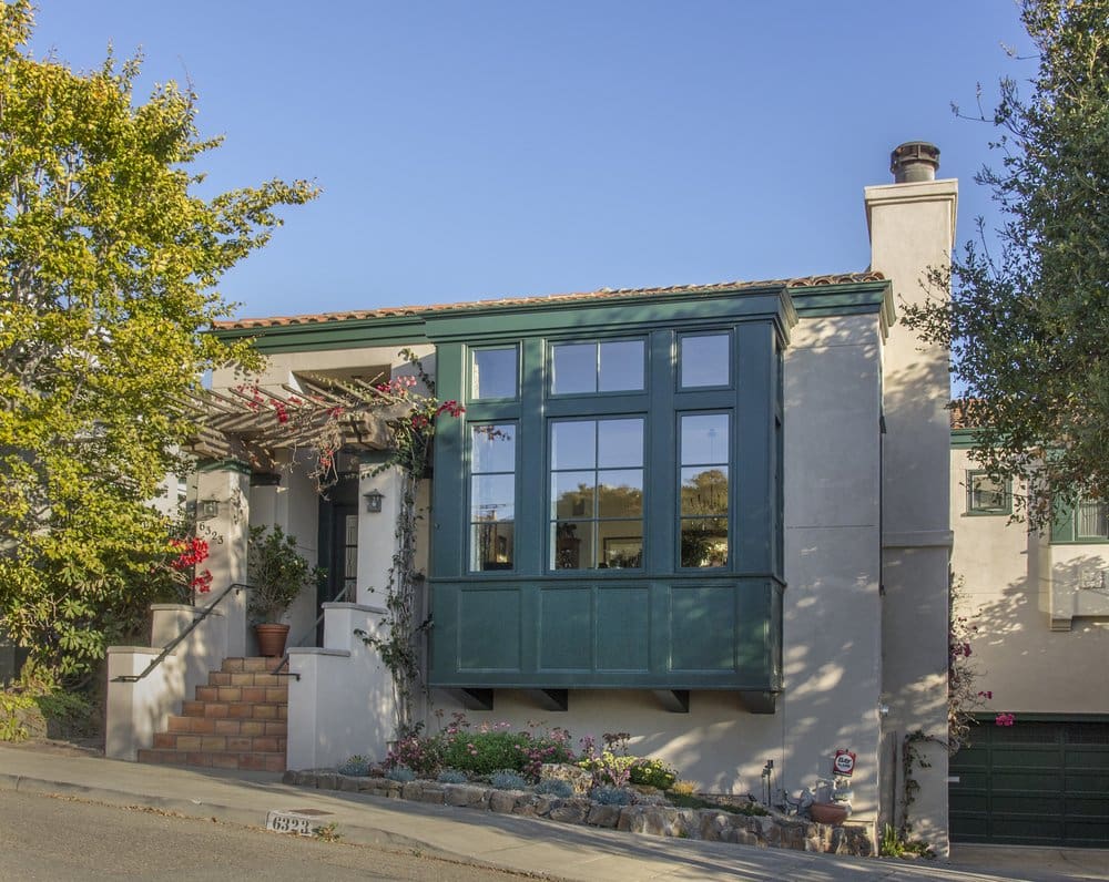 A house with a green door and window.