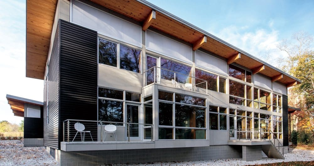 A building with many windows and glass on the outside.