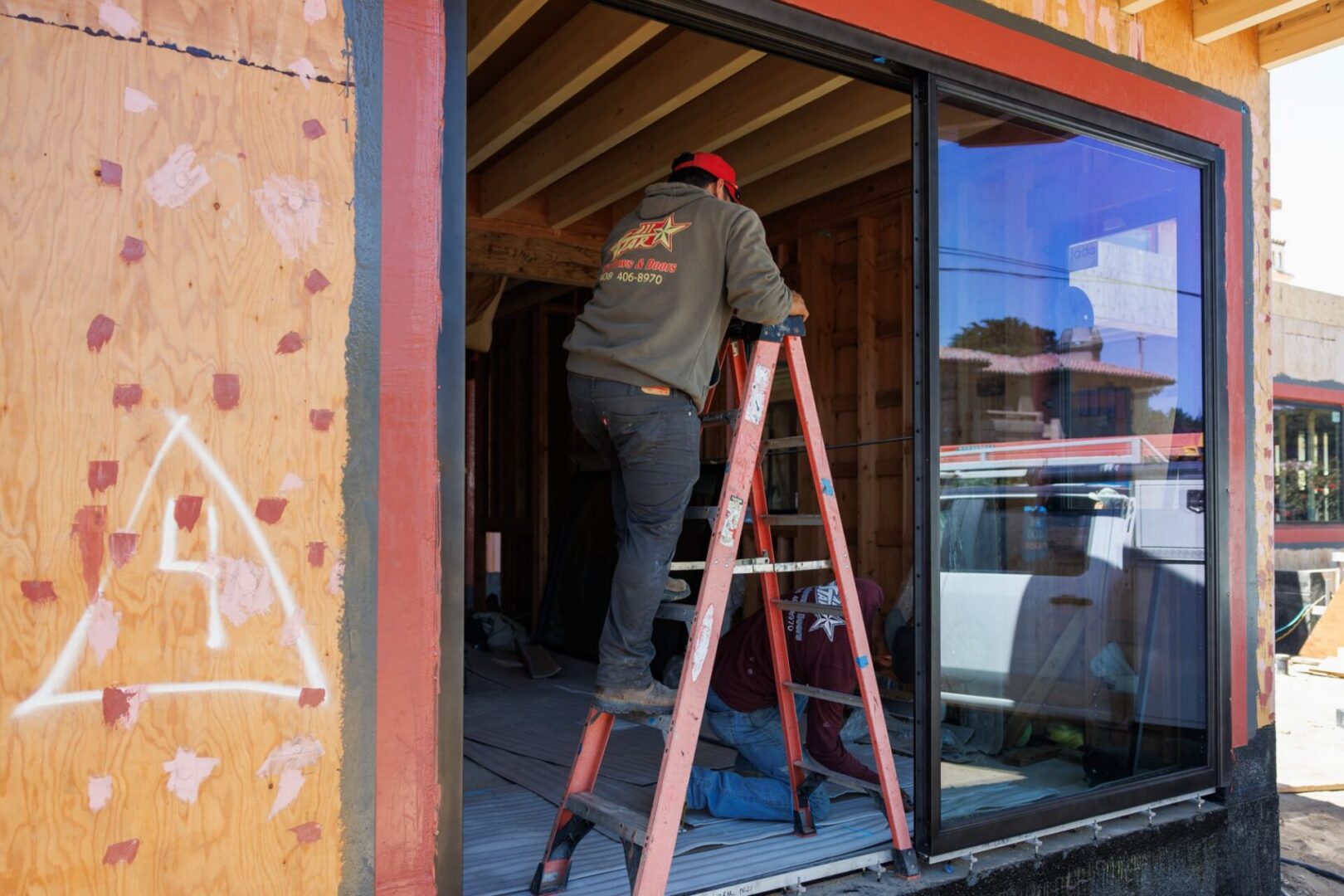 Allstar installer setting a sliding door on a Pebble Beach home